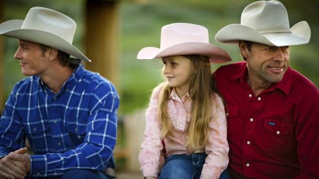 Cowboys mit Mädchen auf der La Reata Ranch